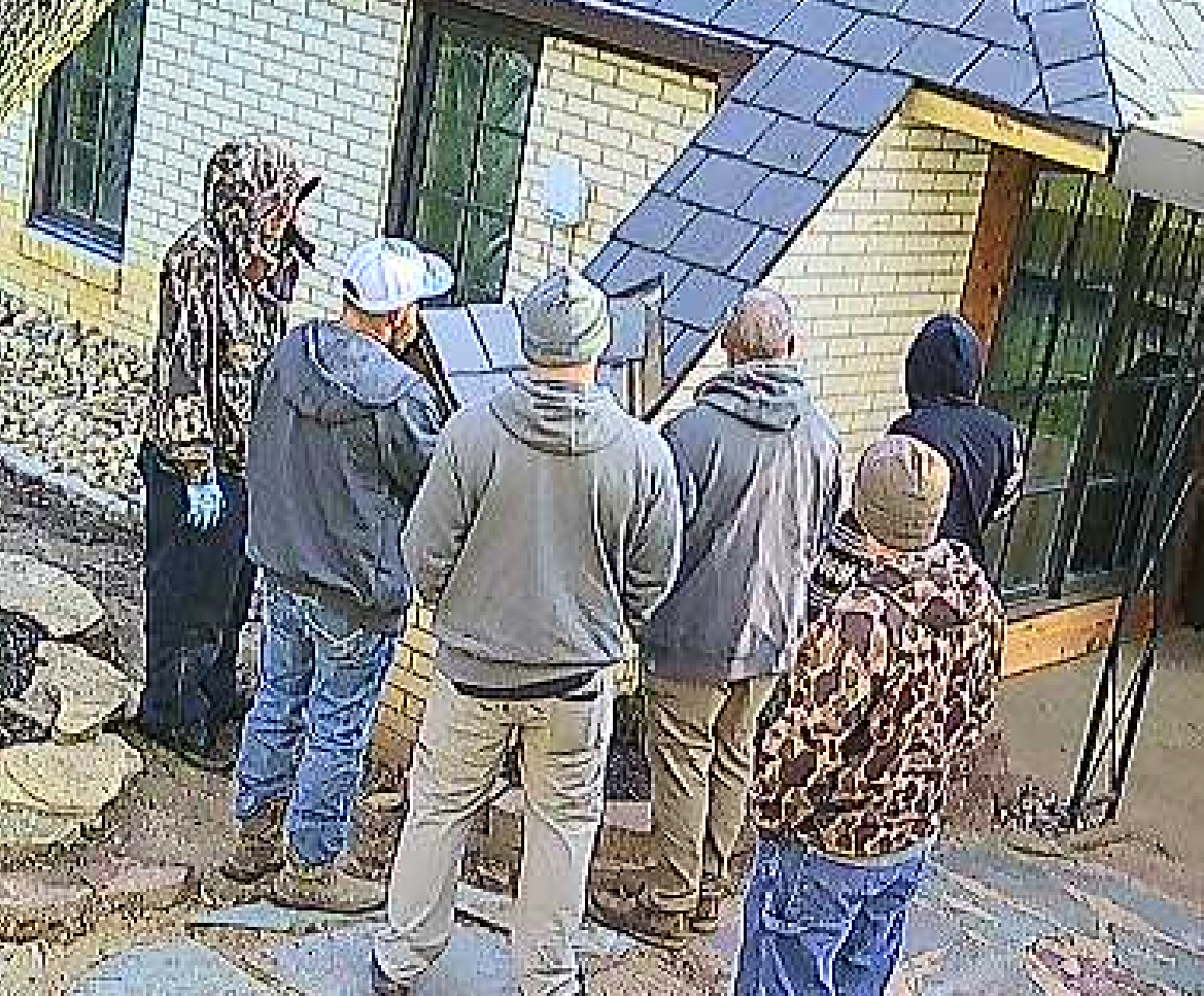THE SECURITY CAMERA CAUGHT OUR ROOFING/BALCONY TEAM HAVING A HUDDLE BEFORE BEGINNING ONE MORNING. :) THEY DID REALLY GOOD WORK!